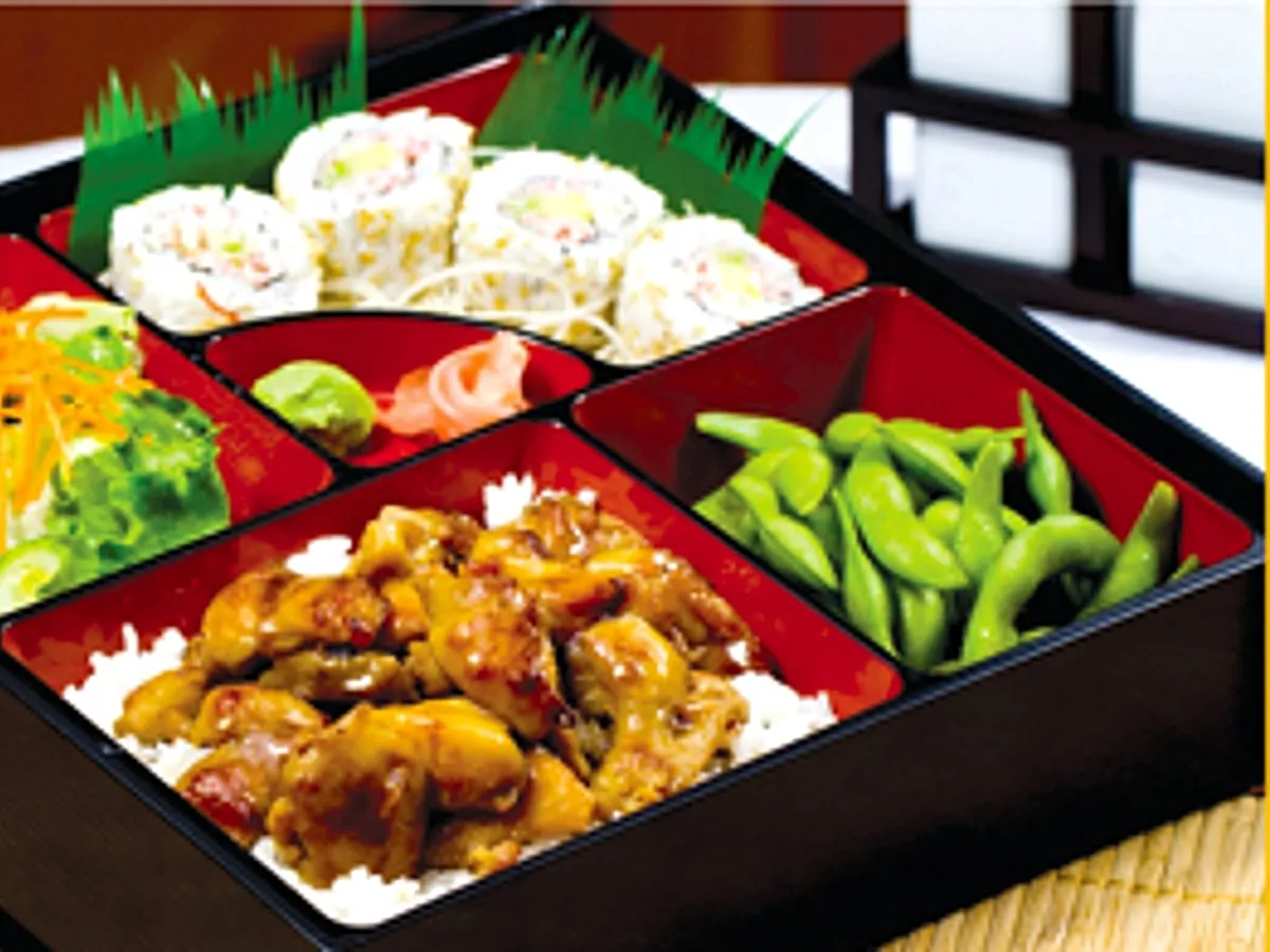 Chicken teriyaki bento box with California roll and edamame